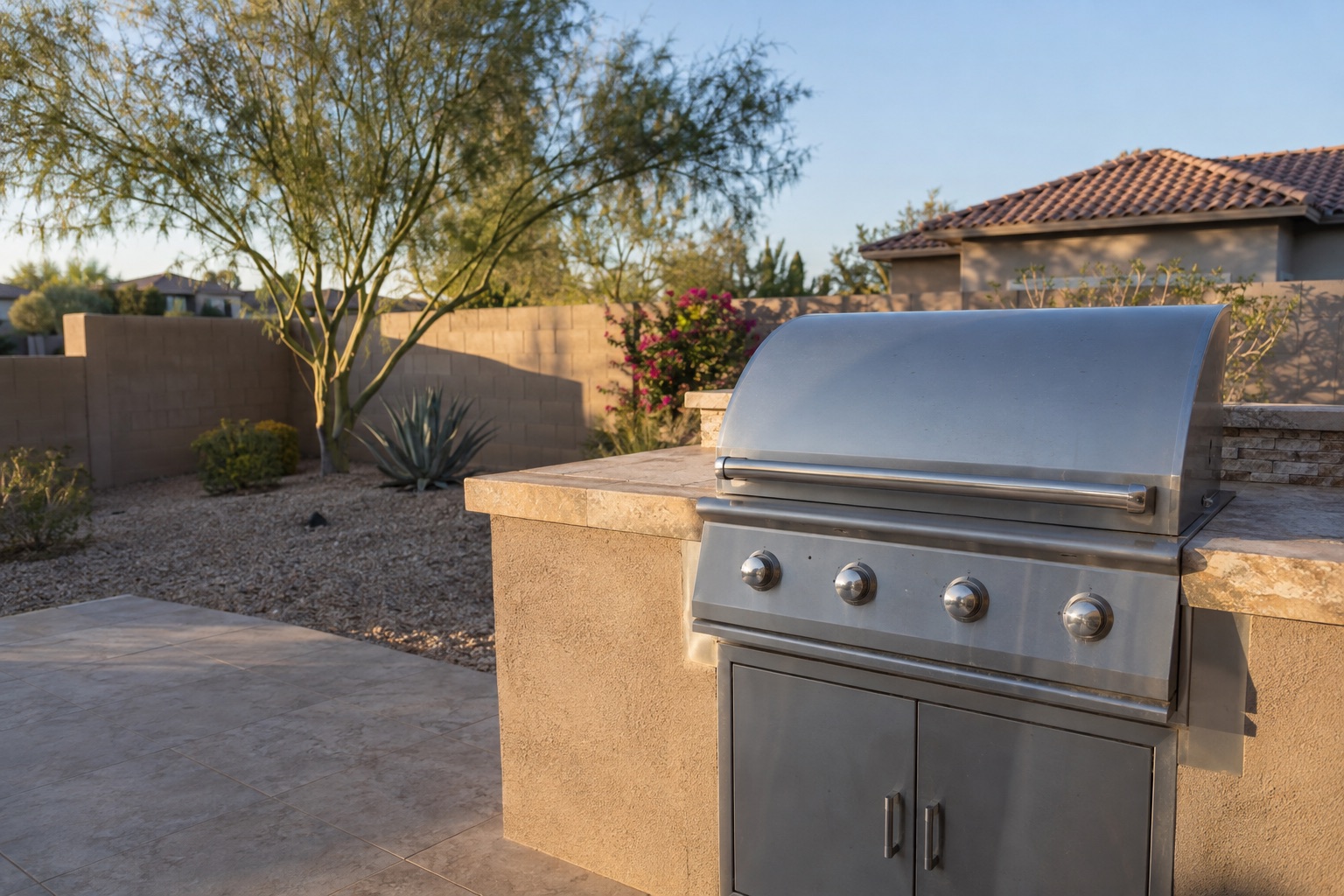Freshly cleaned stainless steel built-in grill in an Arizona backyard
